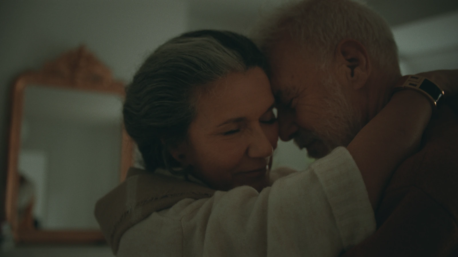 Close-up of the couple leaning into one another